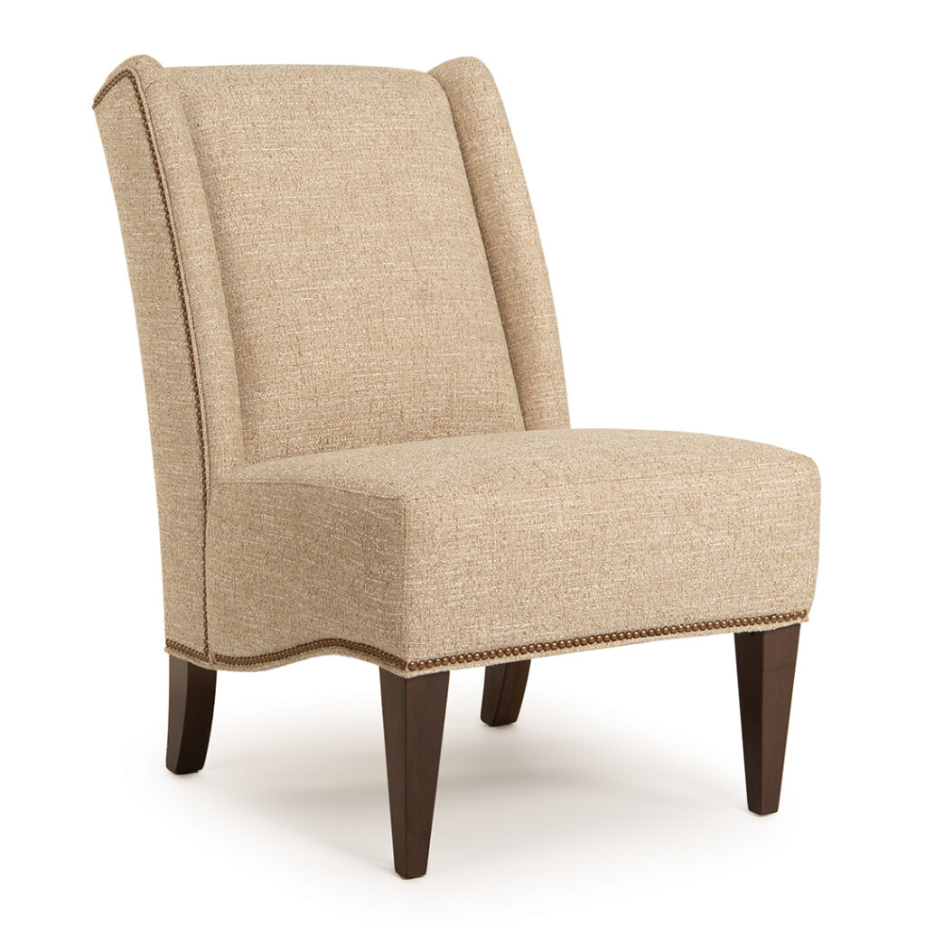 Tan upholstered armchair with wooden legs.